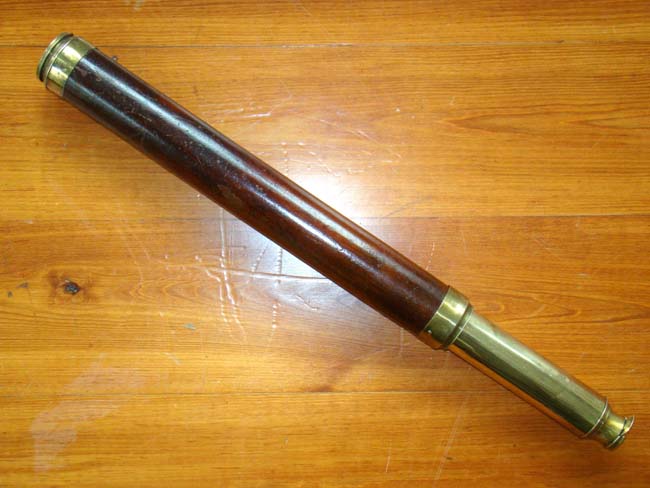 A 19th century English single draw mahogany barreled telescope circa 1830